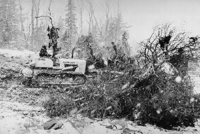 A bulldozer clearing brush from the launch site