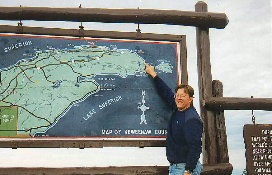 Glen E. Swanson pointing out the location of the KRB